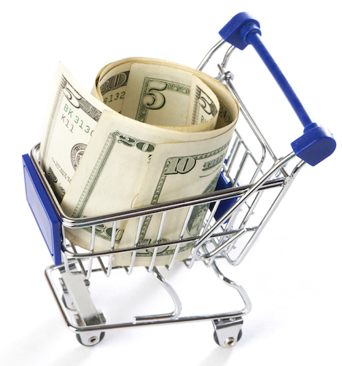 Shopping cart with money isolated on white background