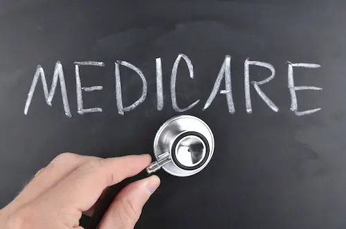 Image of word 'medicare' on a chalkboard