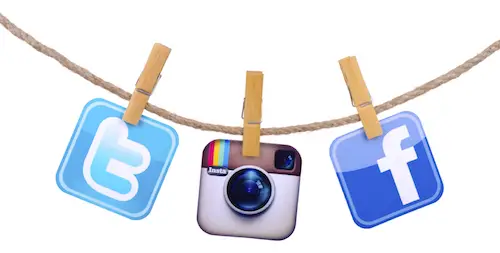 Popular social media Facebook, Twitter,instagram hanging on the clothesline isolated on white background