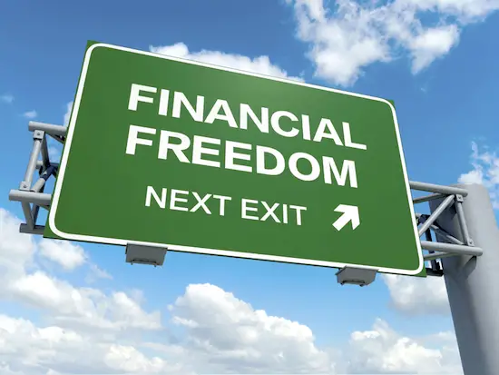 Road sign pointing to 'financial freedom' exit