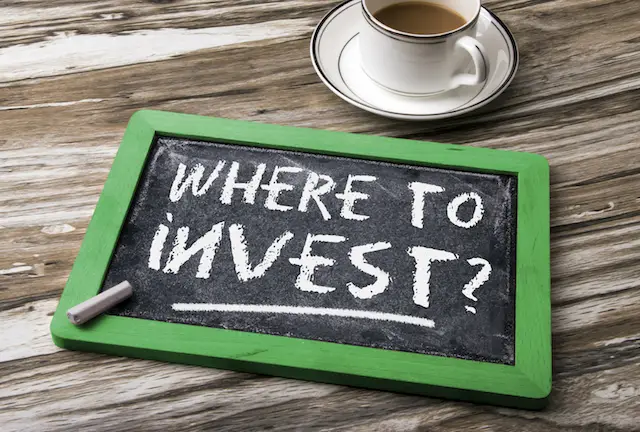 Image of the words 'where to invest?' on a blackboard