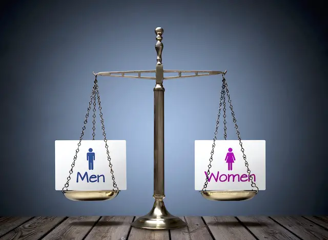 Image of scale with men and women sign on each end