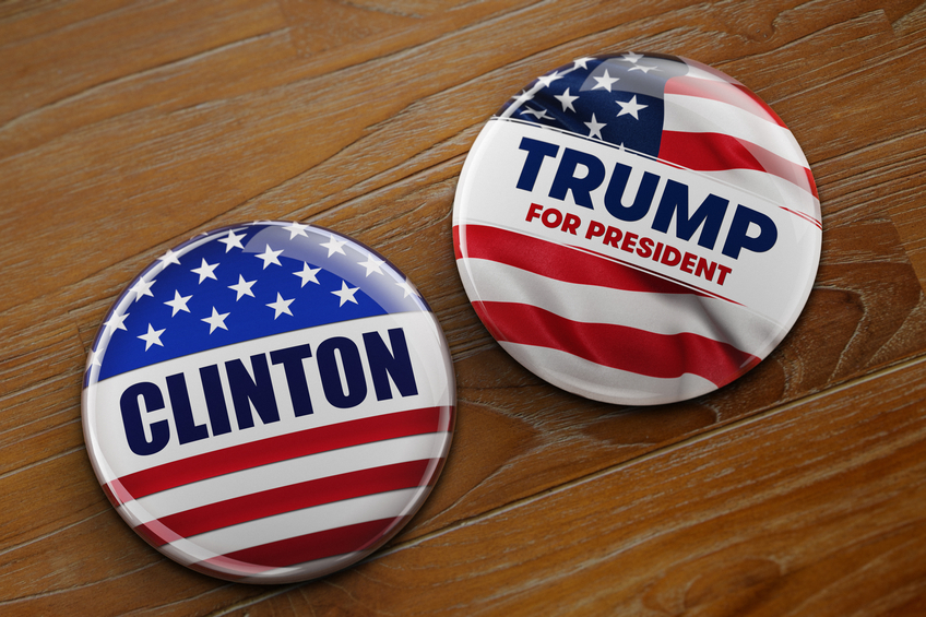 Presidential campaign buttons of Hillary Clinton and Donald Trump.