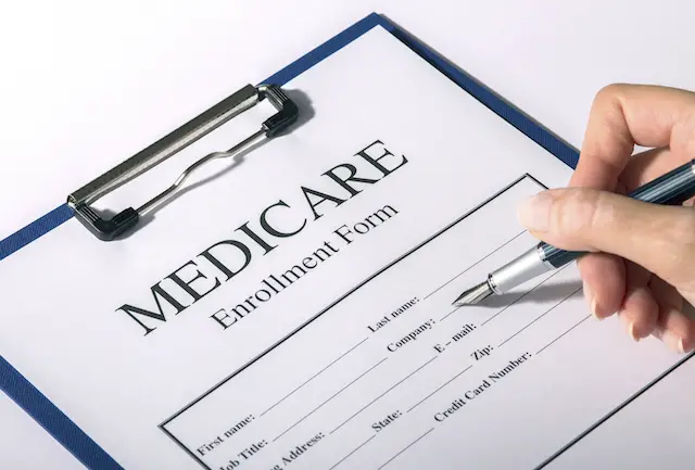 Medicare enrollment form and pen