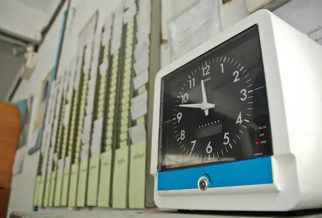 Image of time clock and punch cards