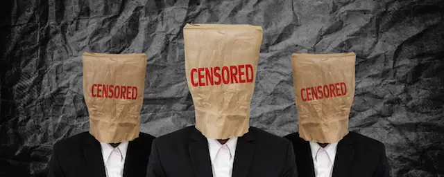 Group of businessman with brown paper bags on their heads with "CENSORED" word written on the bags