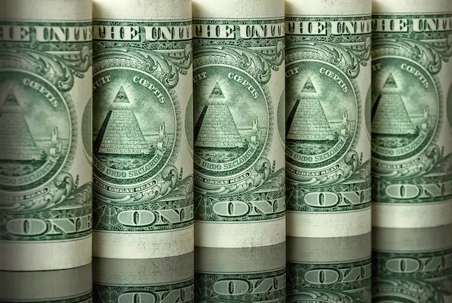 Image of five rolls of one dollar bills