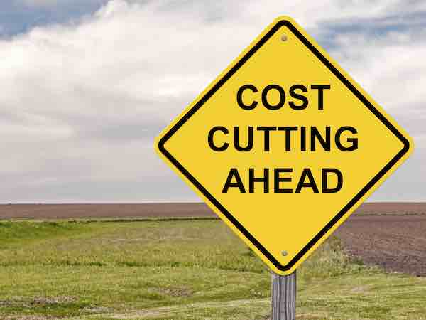 Yellow caution sign reading 'Cost Cutting Ahead'