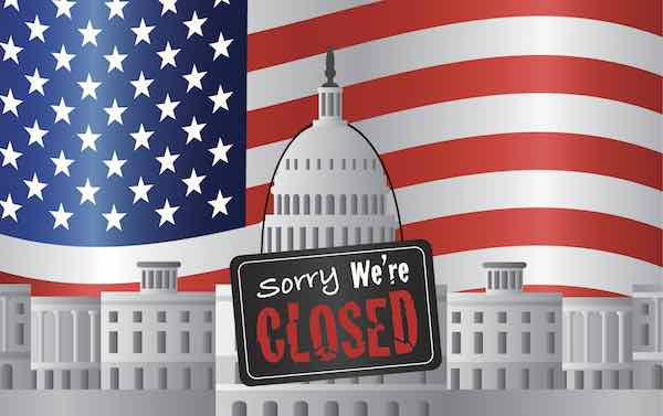 Capitol building with 'We are Closed' Sign on US American Flag Background