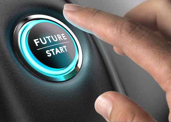 Finger about to press future button labeled 'future start' with blue light over black and grey background