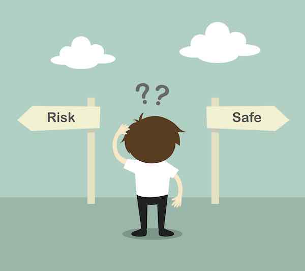 Cartoon of a person looking confused while staring at two signs, one labeled 'risk' and one labeled 'safe'