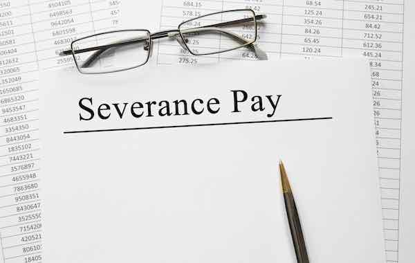 Paper with Severance Pay on a table