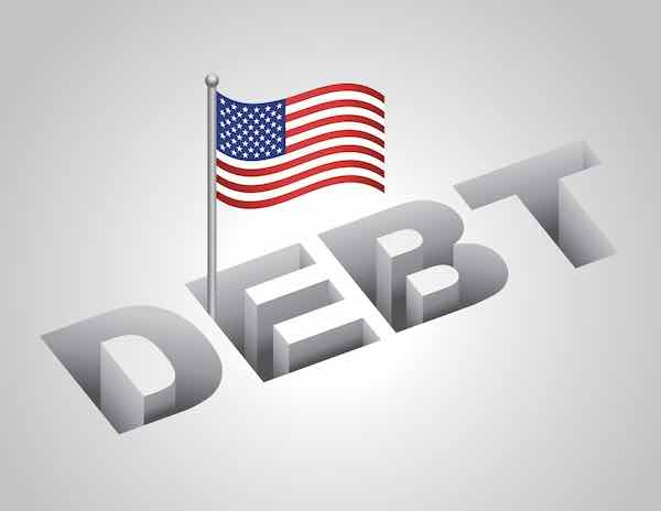 American flag staked in the word 'debt'