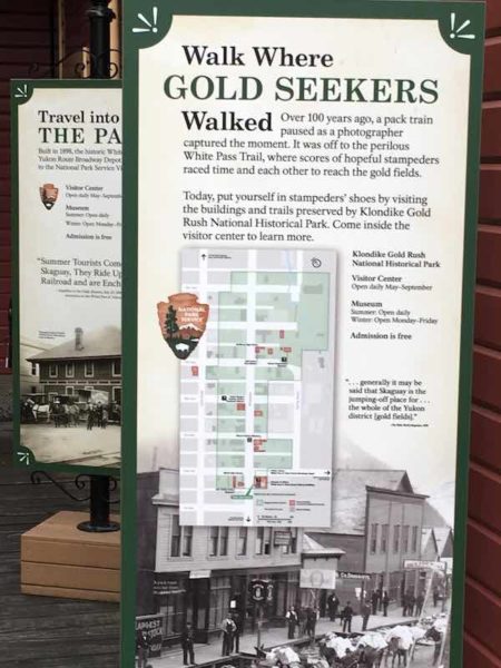 Sign in Skagway, AK at the National Park Service office explaining the history of the area's gold rush in the 1800s