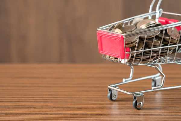 Shopping cart filled with coins