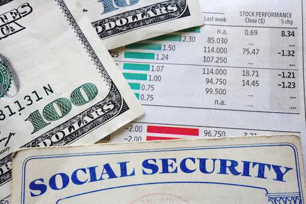Social Security card with $100 dollar bills and a financial statement