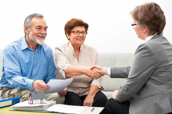 Senior couple meeting with financial adviser
