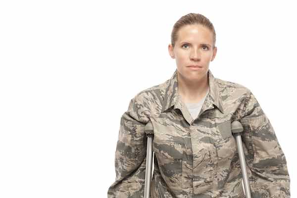 Female military veteran on crutches