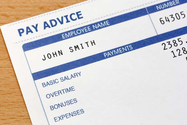 Close up of a pay slip labeled 'John Smith' and 'pay advice'
