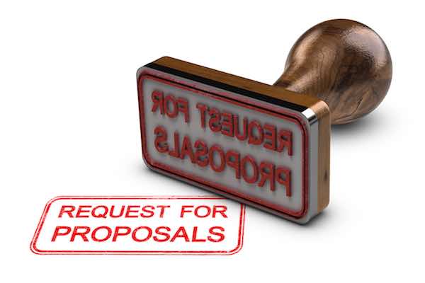 Request for proposals printed on a white background, with rubber stamp