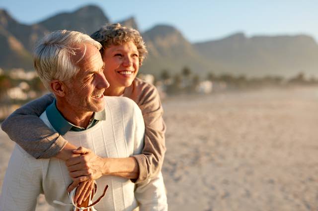 Retired/senior couple enjoying a vacation at the beach