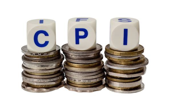 Stacks of coins with the letters CPI isolated on white background