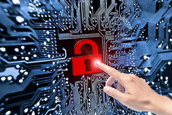 hand pointing to broken security lock symbol on computer circuit board