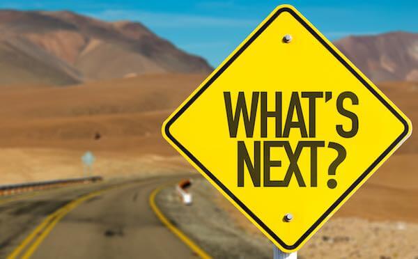 Yellow road sign with the words 'what's next?'