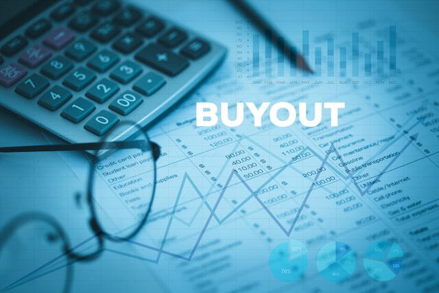 Word 'buyout' overlaid against a background of financial documents, reading glasses, a pen and calculator