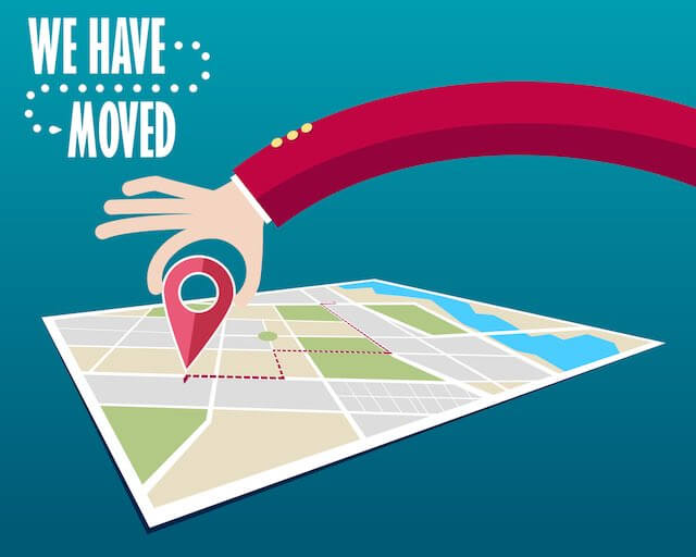 Cartoon illustration of a map and a person's hand moving a GPS marker on it along with the words 'we have moved' depicting a relocation