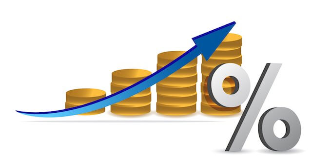 Four stacks of coins growing in size with a blue arrow trending upward and a percentage sign in the foreground depicting inflation/wage/salary growth/pay raises