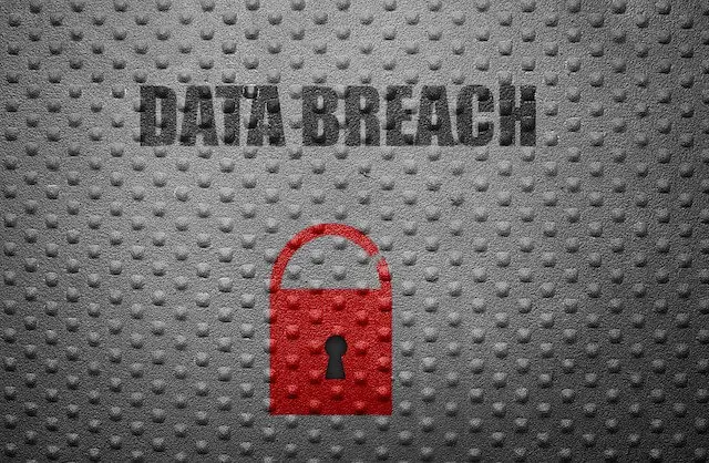 Red padlock pictured on a grey background with the words 'data breach' above it - cybersecurity