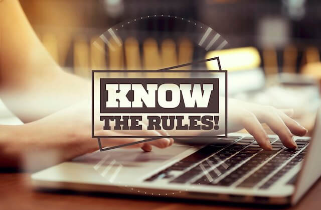 Close up of a woman's hands typing on a laptop while she sits at a desk with the words 'know the rules!' superimposed over the picture