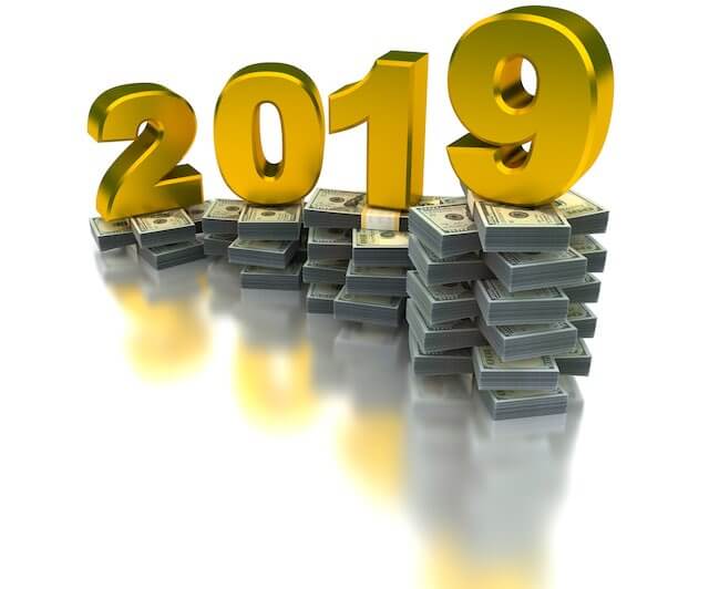 Numbers '2019' pictured over a growing stack of cash depicting a pay raise for 2019