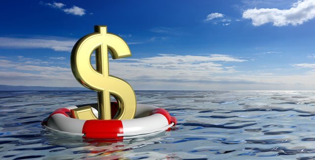Dollar sign floating in a life buoy in icy waters depicting an emergency fund/emergency savings for hard times