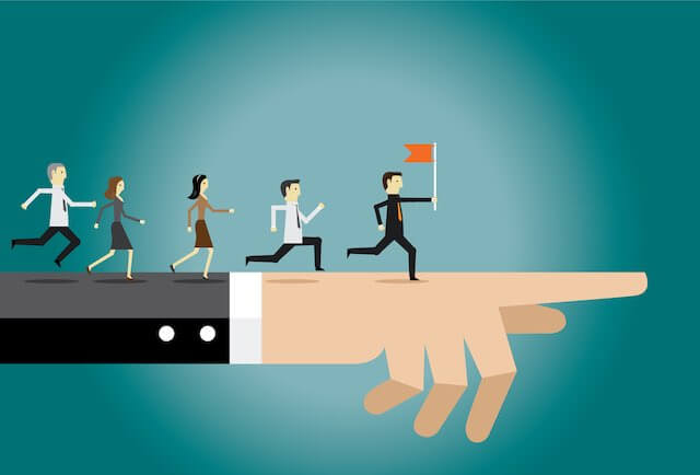Cartoon illustration of a large businessperson's arm pointing to the right with a group of employees running along the top of it in the same direction with the person in front denoted as the leader carrying a flag - teamwork, leadership concept