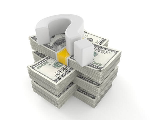 3D question mark lying on top of a stack of $100 bills depicting money questions, confusion, doubts over pay/benefits