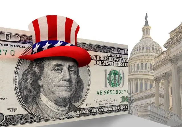 $100 bill with the picture of Benjamin Franklin wearing an Uncle Sam USA hat pictured beside the Capitol building in Washington, DC depicting political donations