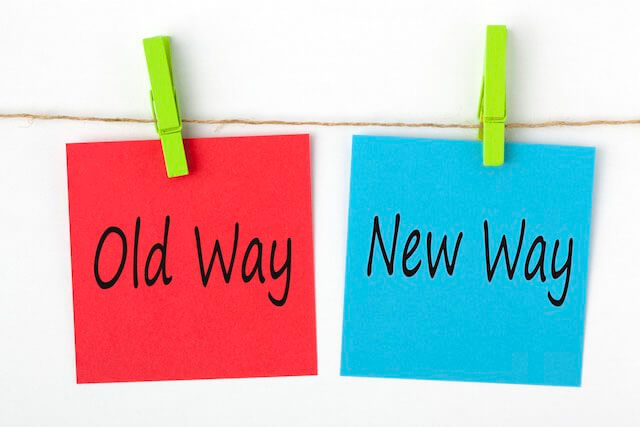 Two cards hanging on a clothesline, one red labeled 'old way' and one blue labeled 'new way' depicting a rule change