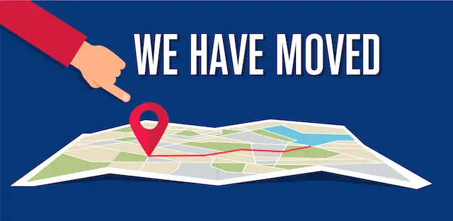Illustration of a map lying flat on a solid blue background with a GPS marker on it and the words 'we have moved' above it