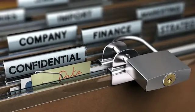 Filing cabinet opened to a file tab labeled 'confidential' with a padlock on the front of it