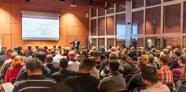 Speaker giving a presentation at a business conference