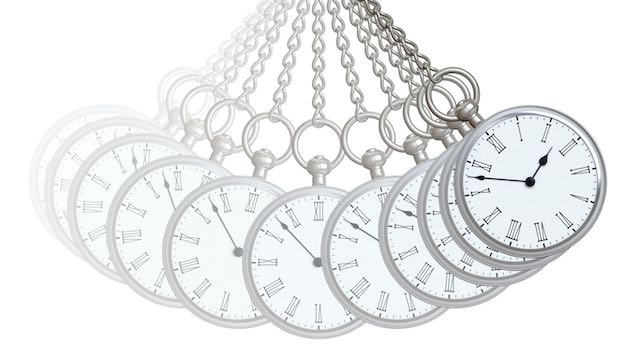 Pocket watch swinging back and forth in a pendulum motion