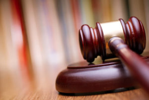 Wooden judge's gavel on a desk