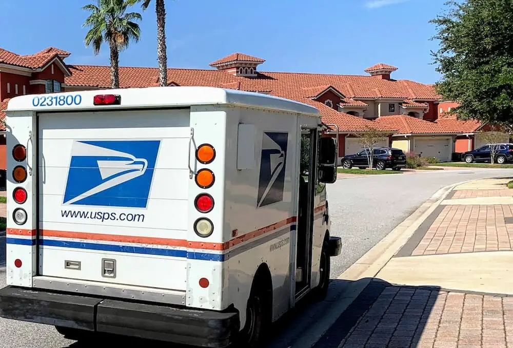 Post Office mail truck (USPS) parked on a neighborhood street