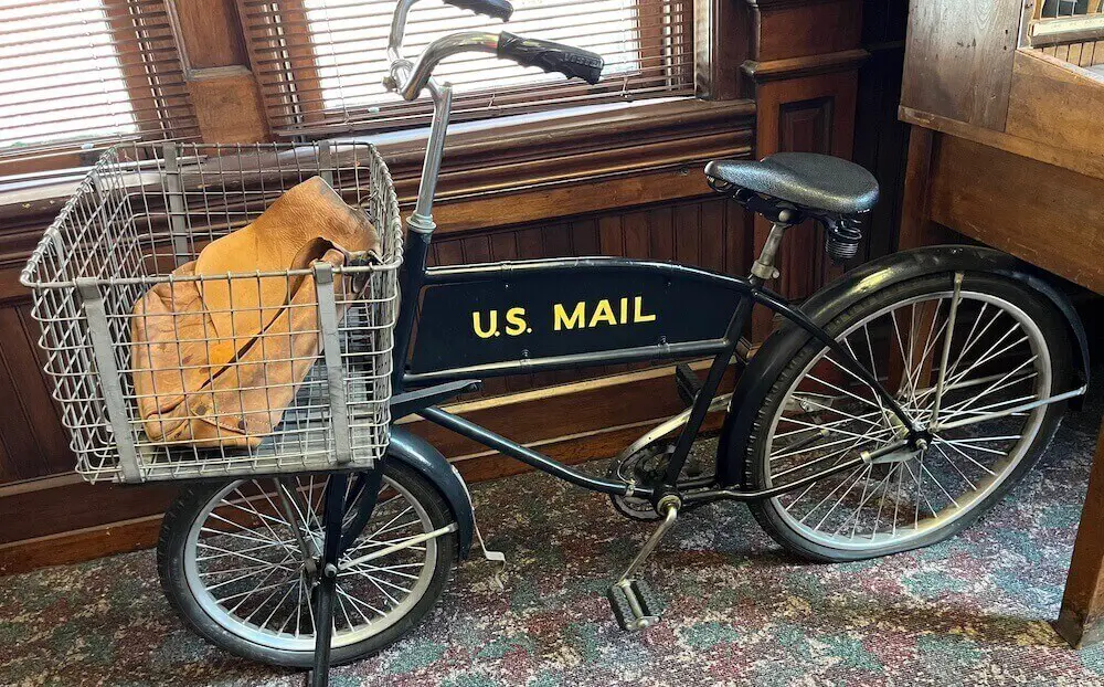 Bicycle that reads 'US Mail' on display inside of the Postal Museum in Charleston, SC