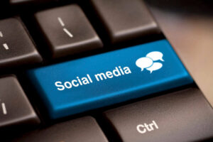 Blue key on a keyboard that says "social media"