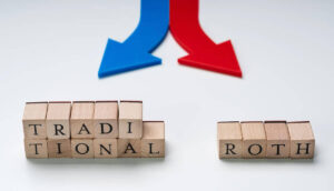 Red and blue directional arrows pointing in opposite directions, one at block letters that spell 'traditional' and the other and block letters that spell 'roth'