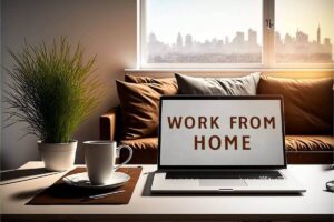 laptop on a coffee table in front of a couch with the words 'work from home' displayed on the screen; a window with a city skyline is pictured in the background