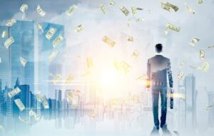 Businessman walking towards a city skyline with cash appearing to fall around him